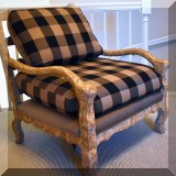 F19. One of a pair of Bergere chairs with plaid upholstery. 